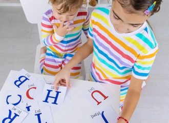 The child learns English letters. Selective focus. Kid.